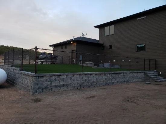 Black chain link fence around the backyard