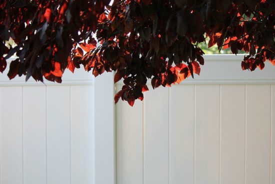 Commercial white vinyl fence installation