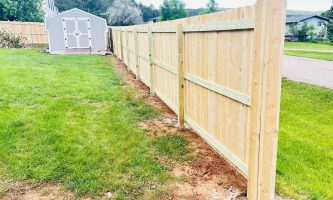 Wooden fencing in yard Wooden fencing in yard